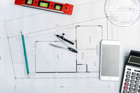 Top view of  Measurement tool and dividers or compasses on blueprint, architectural concept.
