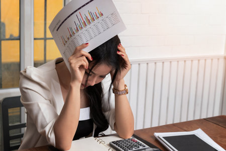 Tired stressful and upset businesswoman with graph report problem and question from project work.