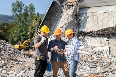 Demolition control supervisor and contractor discussing on demolish building.