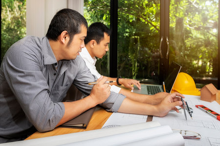 Confident team of architect working together in a office.They discussing about new startup project...