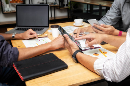 Business team meeting and discussing project plan. Businessmen discussing together in meeting room. Professional investor working with business project together. Finance managers task.の写真素材