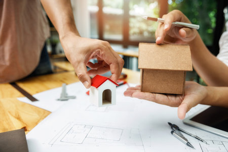 Confident team of architect working together in a office.Then discussing about new startup project on desk. Architect discuss with engineer about project in office, architectural conceptの写真素材