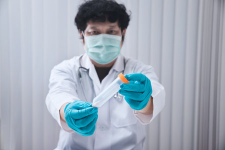 Doctor or medical staff is collecting secretions from patient for examination in the lab. Pandemic Coronavirus, COVID-19.の写真素材