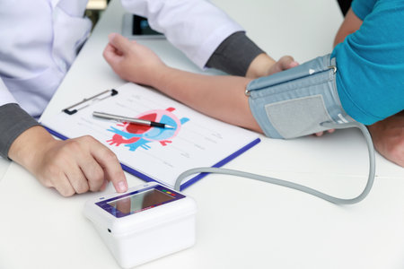 Doctor measuring blood pressure of the patient in the hospital, Medical and health care concepts.の写真素材