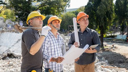 Demolition control supervisor and contractor discussing on demolish building.の写真素材