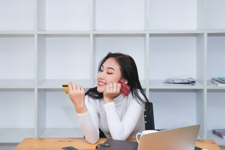 Stressful asian businesswoman with huge amount of credit card debt.の写真素材
