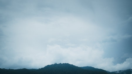 Storm cloud over the mountain range. Rain clouds are creeping over the mountains.の写真素材