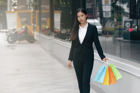 Happy woman with shopping bags enjoying in shopping.の写真素材