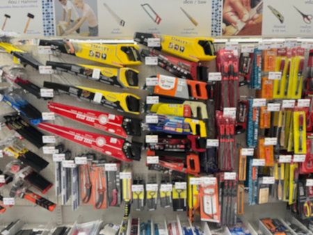 Blurred hardware tool background for advertisement, template, and design use. Hand tool and saw...