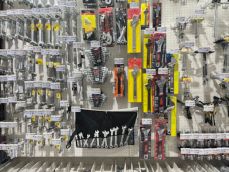 Blurred image of Hand tools on shelf display at store for background. Showcase of tool store....
