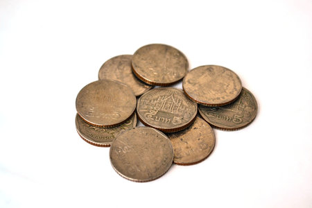 Five bath coins thailand on white background