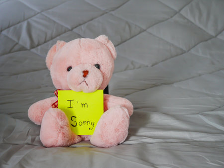 I'm sorry on post note with teddy doll on bed