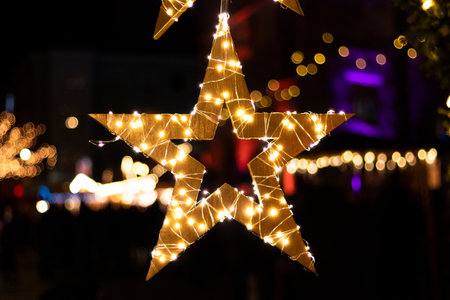 Christmas star with lights and great bokehの写真素材