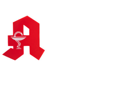 German pharmacy sign, on the left, isolated with white backgroundのeditorial素材