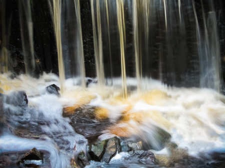 waterfall of stream with stonesの写真素材