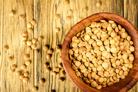 Lentils on the plate. Healthy diet. The family of legumes. Rustic style. Place for text.の写真素材