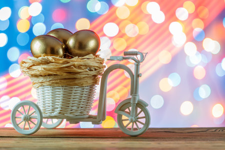 Easter card. Golden eggs in a Bicycle cart. Egg. happy Easter.の写真素材