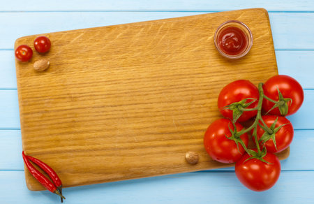 Italian kitchen, cutting Board with tomatoes. Place for Your text. Preparation of pasta. Menu title page.の写真素材