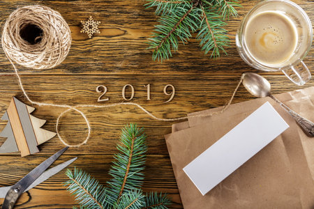 Preparation of gifts for The new year 2019. Creative mess on the table. Cozy home environment. Preparing a surprise. Christmas sale.の写真素材