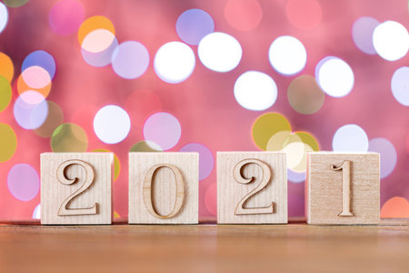 Happy new year 2021. Wooden cubes with numbers. Year of the bull. Blurred background.の写真素材