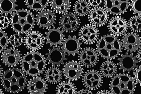 Gears abstract background. Products made of different metals. Macro photo. Black and white image....