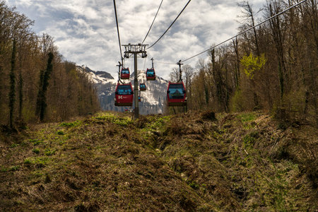 Krasnaya Polyana cable car / Gondola for climbing a mountain peak. Operation of lifting mechanisms....