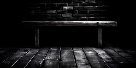 Old wooden table and brick wall background. Black and white image.の素材