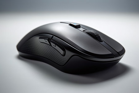 Wireless computer mouse on a white background, close-up.の素材