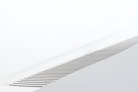 Escalator on a white wall, close-up of photoの素材
