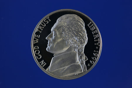 Jefferson nickel proof on blue background