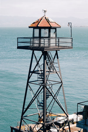 Watchtower on Alcatraz Island, San Francisco Bay, bright blue water