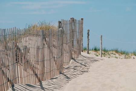 Wooden fence on the beach, Cape Cod, summer timeの写真素材