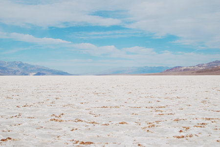 Landscape with cloudy sky and salt flats, Badwater Basin, Death Valley National Parkの写真素材