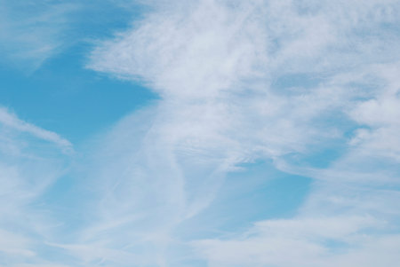 Bright blue beautiful sky background with light clouds