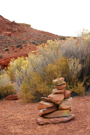 Cairn, pile of stones in red desert, Utah, USA
