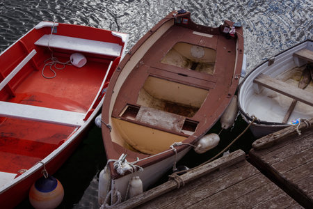 Few old wooden boats at the pier, New Englandの写真素材
