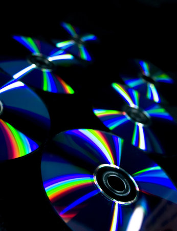 Compact disc on a background of black fabricの写真素材