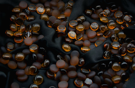 Glass balls on black silkの写真素材