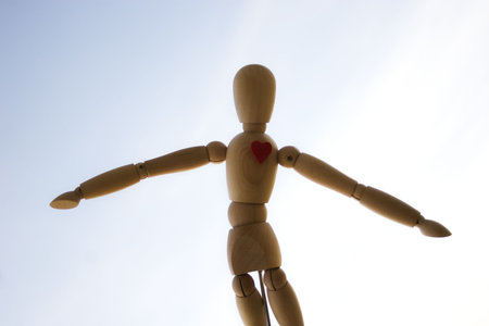 Wooden dummy against the skyの写真素材