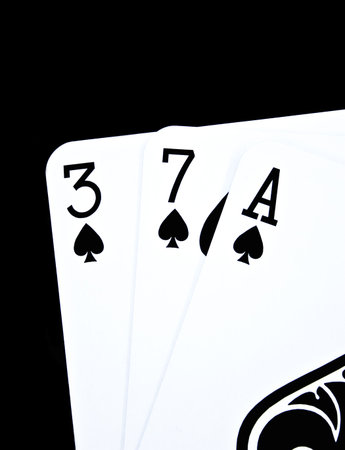 Playing cards on a black backgroundの写真素材