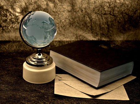 glass globe and the old bookの写真素材