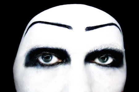 Eyes of the mime close up on a black backgroundの写真素材