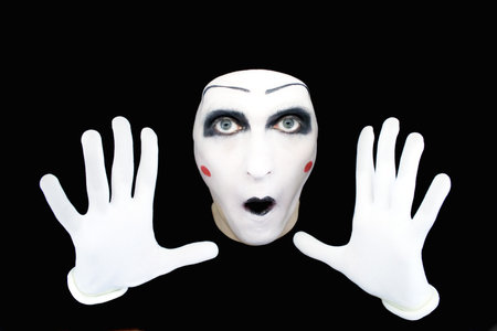 Portrait of the mime in white gloves on a black backgroundの写真素材