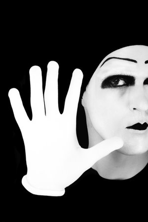 Portrait of the mime in white gloves. Stop it.の写真素材