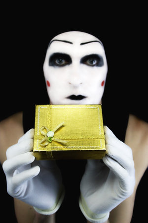 Portrait of the mime with a giftの写真素材