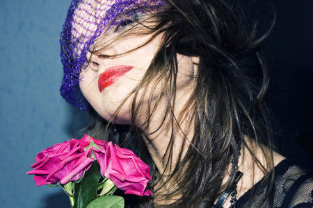 Portrait of a young woman in the veil with rosesの写真素材