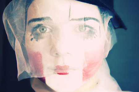 Portrait of the sad mime in a veilの写真素材