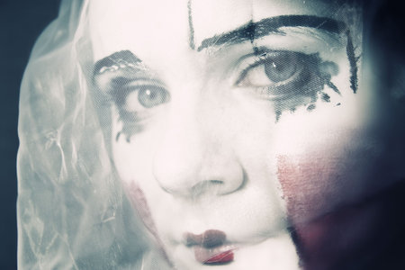 Portrait of the sad mime in a veil