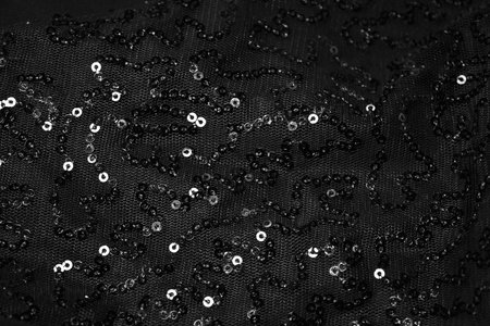 bead; backgrounds; pattern; textile; clothing; decoration; embroidery; macro; nobody; circle; garment; female; fashion; gray; close-up; design; ornate; beautiful; little; textured; material; blackの写真素材