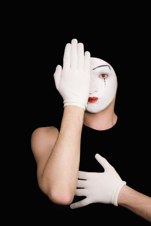 Portrait of artful peeping mime in white glovesの写真素材